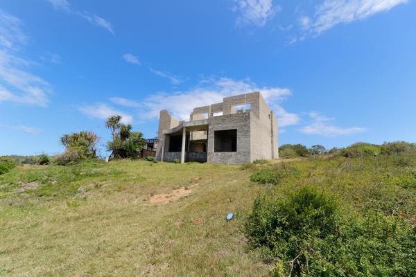 Seize the chance to create your dream home with this unfinished cement brick house in a ...