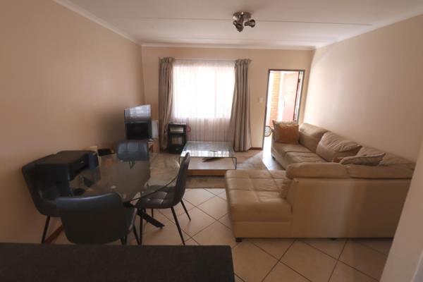 Gorgeous kitchen with lots of cupboard space, a stove with oven, dual sinks, and space ...