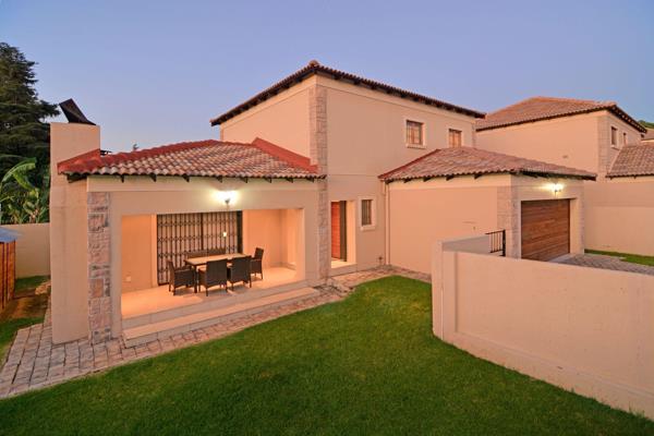 Spacious formal lounge with sliders to covered patio and built-in braai. Designer kitchen includes gas hob, eye-level oven and space ...