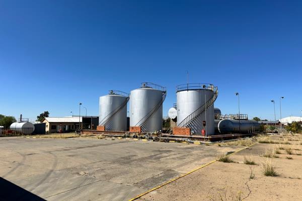 This property consists of a foreground with two pumps as well above ground tanks with admin building storage space warehouses wash bay ...