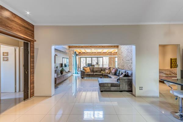 Welcome to this fully renovated family home in the highly sought-after Fourways Estate, offering modern living at its finest. Flooded ...