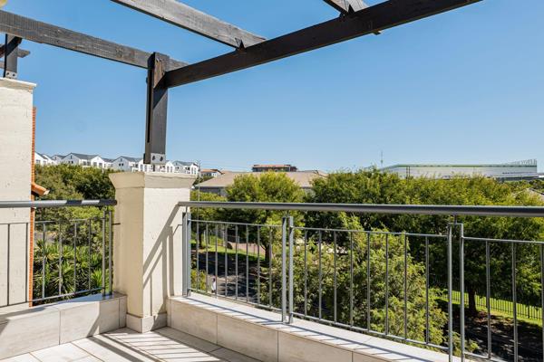 This third-floor loft apartment is part of the secure Acacia Complex.

The unit boasts a ...