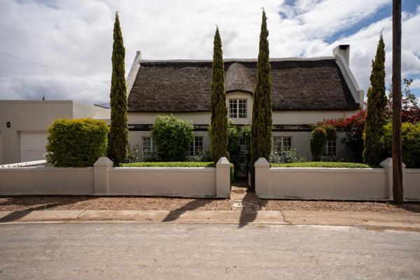 Experience the enchanting allure of this beautiful thatch home, set amidst an exquisite ...