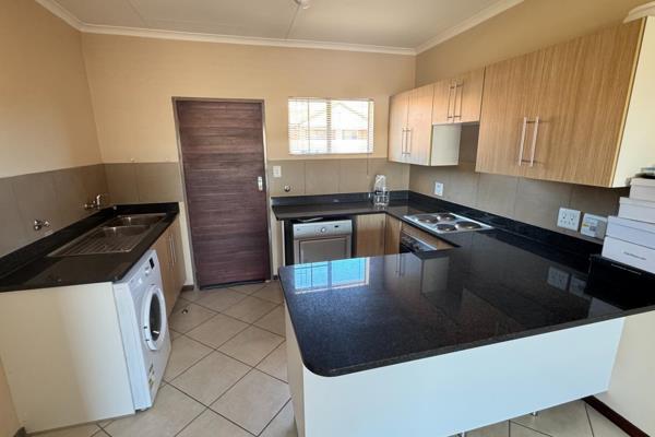 The beautiful open plan kitchen (with space for 2 x under counter appliances) overlooks a spacious living and dining area that leads to ...