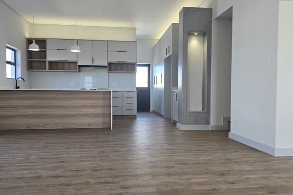 Walk into style and space entering this three-bedroom home.

Spacious open-plan living is at your fingertips when opening the aluminum ...