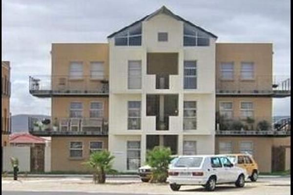 Spacious and secure top-floor apartment available for rent on Parklands Main Road. It features an open-plan lounge and dining area ...