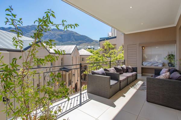 EXCLUSIVE MANDATE: This modern and spacious apartment boasts a large balcony with a gas BBQ, perfect for outdoor entertaining while ...