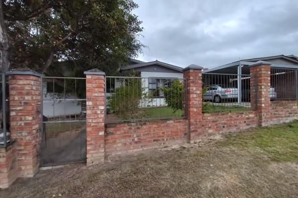 Welcome to this inviting family home that blends comfort and style! Featuring an open-plan kitchen with ample built-in cupboards and a ...