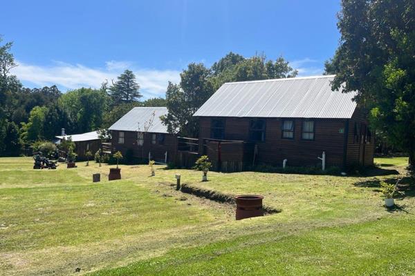 Nestled in the heart of the lush Harkerville Forest and embraced by scenic hiking trails, this expansive lodge property presents an ...