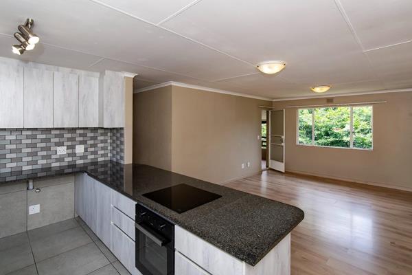 This upstairs unit has been tastefully renovated.  An open plan living area opens out onto a covered balcony.  There are two well sized ...