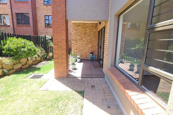 Neat ground floor unit to rent with a garden and parking under a carport in front of the ...