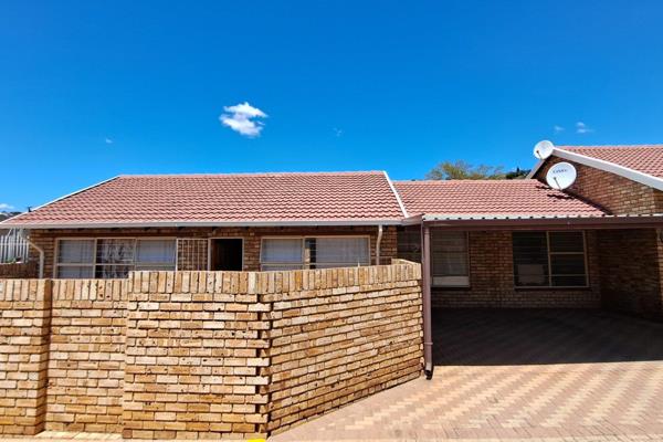 This immaculate freestanding single-story face brick townhouse is the epitome of ...