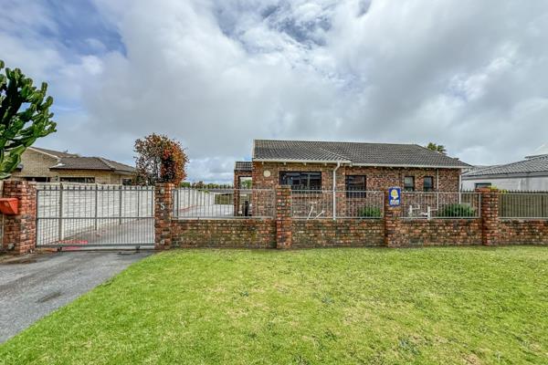 This charming family home invites you into spacious living areas that flow seamlessly ...