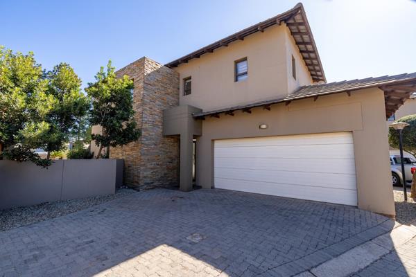 This exquisite three-bedroom, two-and-a-half-bathroom cluster home offers a luxurious lifestyle within a serene golf estate. Designed with modern aesthetics, the open-plan living area features sleek lines and ample natural light, seamlessly connecting the spacious lounge ...