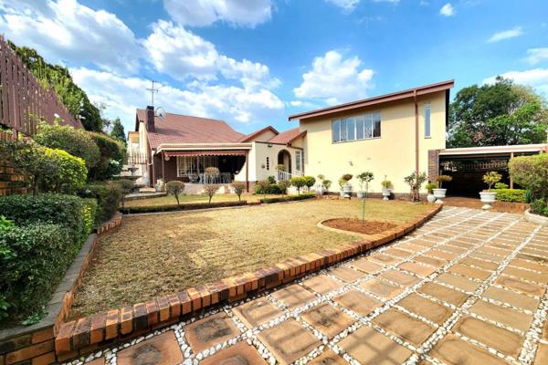 This stunning property features 4 spacious bedrooms, all adorned with beautiful wooden ...