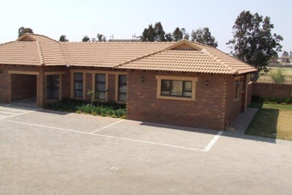 Exterior: This modern single-story home in Heldercrest, Helderwyk, offers a clean, welcoming façade with a mix of brick and ...