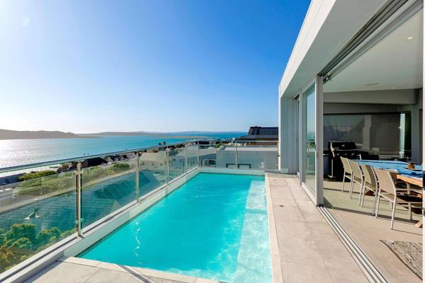 Step into a world of elegance and tranquility and marvel at the unobstructed Lagoon and Kraalbaai views from this exquisite 3 level ...