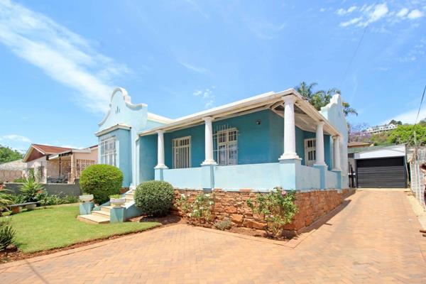 This quaint “Cape Dutch” style home with beautifully maintained compact garden ...