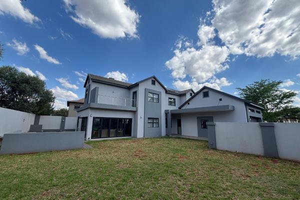 This spacious and stylish home offers comfortable, secure living within the prestigious Zwartkop Golf Estate. Designed with family ...