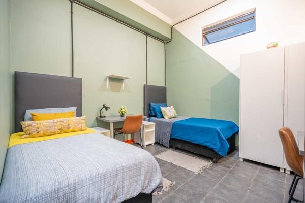 Private 2-sleeper furnished unit boasting 2 beds, side tables, study desks, wardrobes ...