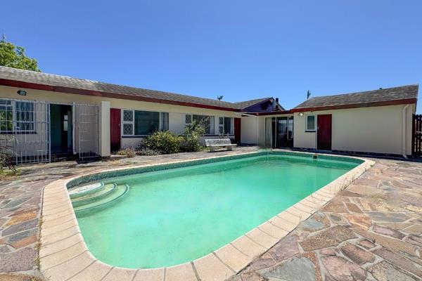 Nestled on an expansive, north-facing lot, this charming 1960s-era home transports you ...