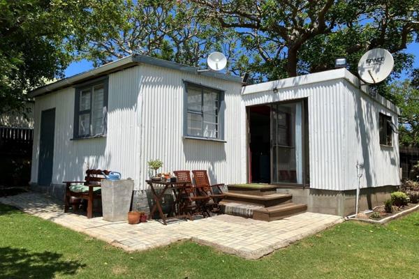 Exclusive Mandate. This charming one bedroom cottage is perfect for cozy living.  It has ...