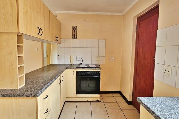 This unit offers two carpeted bedrooms, both with built in cupboards, as well as two ...