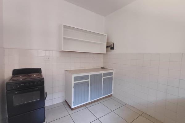 The flat features a spacious bedroom with built-in cupboards, a separate living area and a bathroom equipped with a bath, toilet ...