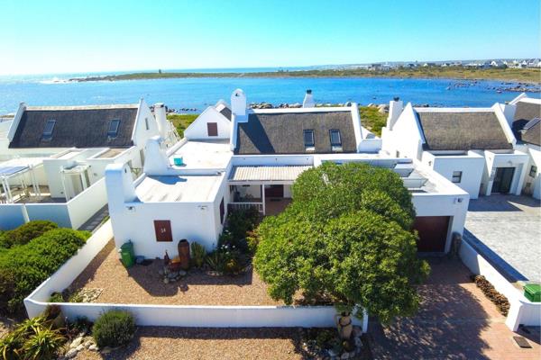 Welcome to your coastal retreat in Jacobsbaai! This remarkable beachfront home promises ...