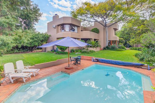 Enter this luxurious home through grand double doors, with a double-volume entrance hall, bathed in light from skylights and surrounded ...