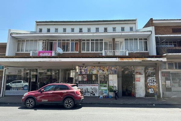 This huge investment opportunity is not to be missed! Fitted with two shops and SEVEN units. This wonderful rental income is a must ...