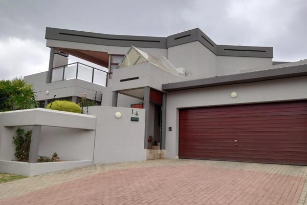 Welcome to your dream home in the serene, secure boomed area of Marais Steyn Park! This stunning double-storey house offers a lifestyle ...