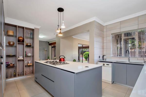 With upgrades and sophisticated touches throughout, to go with the good old value of a traditional Weltevreden Park house, this family home offers space and luxury in abundance. 

The kitchen is an absolute showstopper. A central island sits at the heart of the kitchen ...