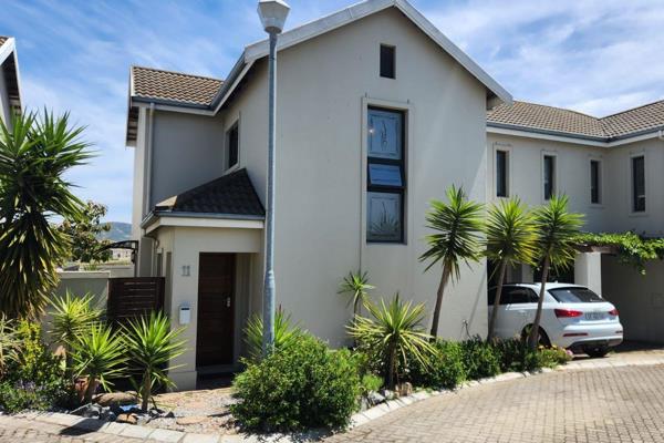 This ultra modern duplex in Graanendal Security Estate comprises:
Tiled entrance to a ...