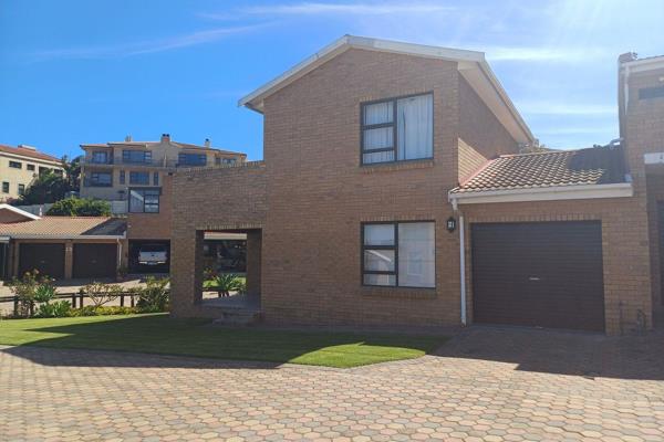 Nestled in the scenic neighborhood of Menkenkop, Hartenbos, this delightful townhouse ...