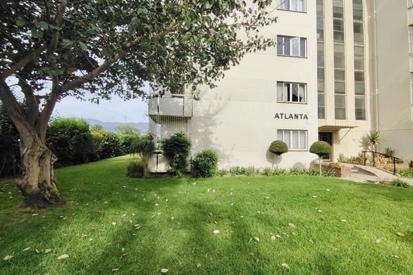 Spacious two-bedroom apartment in the heart of Paarl, featuring built-in cupboards, a large lounge opening onto a private enclosed ...