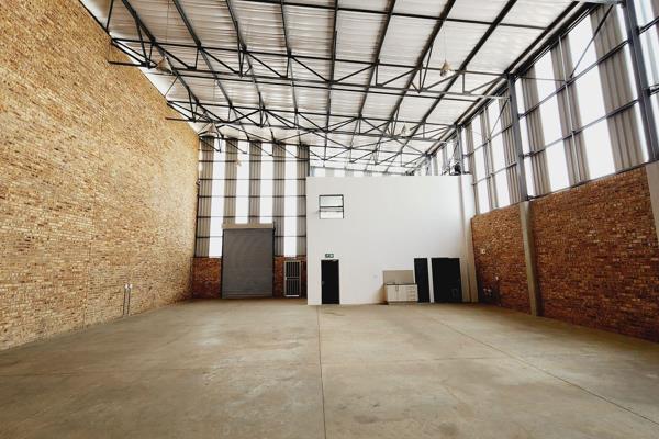 A modern industrial warehouse is available for lease or purchase in a secure business ...