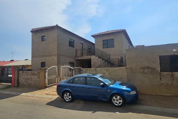 1, A dwelling offering 8 rooms each with ensuite .
2. It offers big rooms
3. It needs to be finished off that include ceiling, tubing  ...