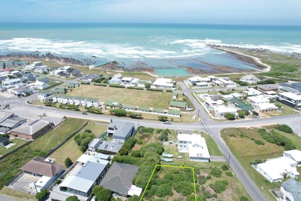 Exclusive Mandate : Nestled just meters from the shimmering ocean, this remarkable vacant stand in Agulhas, the southernmost coastal ...