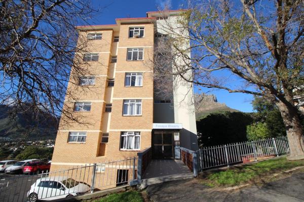 This is an unfurnished 2-bedroom apartment located on the 4th floor at Firdalia Heights in Tamboerskloof, featuring a balcony that ...