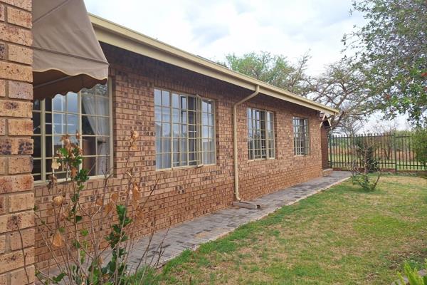 This charming 3-bedroom face brick home, with a tiled roof, blends style and function, offering everything needed for comfortable ...