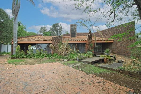 Discover this spacious facebrick home located on a secure boomed-off road in the ...