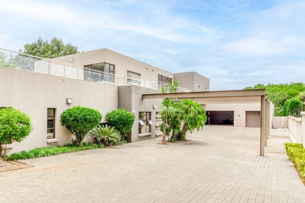 This extraordinary luxury property located in Bryanston East, positioned within a highly ...