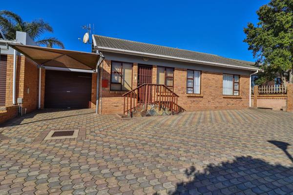 This well-kept face brick home, situated in a secure and pet-friendly complex, is thoughtfully designed for both comfort and ...