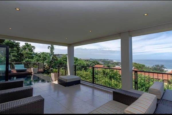 This exquisite home in Simbithi Golf Estate offers luxurious living with sweeping 180-degree sea views. Upon entry, you’re greeted by ...