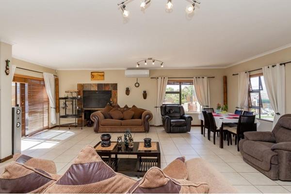 Discover this spacious and inviting three-bedroom home with 2 bathrooms in the ...