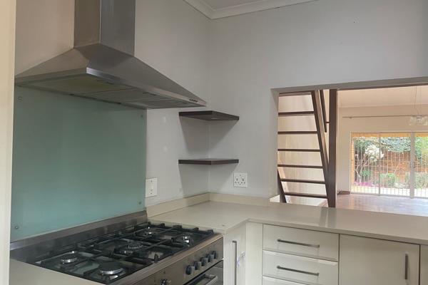 A trendy and modern beautiful home offering a stunning designer kitchen with gas stove, glass splashback, lots of cupboards and ...