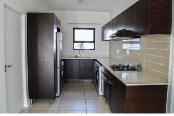 This fully tiled apartment features and open-plan design with ample space for both dinning and lounge area.
The contemporary kitchen is ...