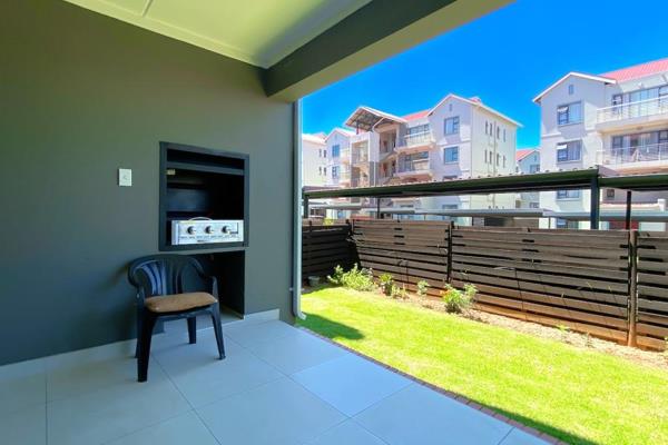 Entrance hall and lounge leading to a covered patio
Kitchen with a breakfast nook, granite tops, a gas stove and space for 3 major ...