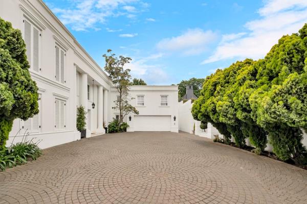 Nestled on a quiet, boomed-off street in the heart of Hyde Park, this magnificent north-facing home exudes sophistication and timeless ...